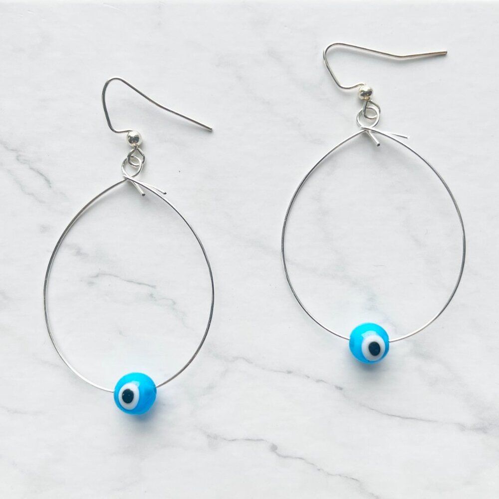 Silver Wire Tear Drop Earrings with Light Blue Evil Eye Glass Bead